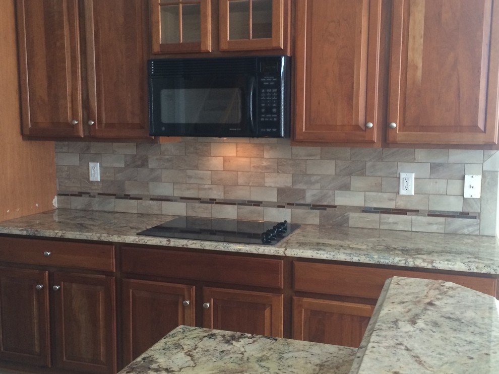 Kitchen - kitchen idea in DC Metro with beaded inset cabinets, medium tone wood cabinets and gray backsplash
