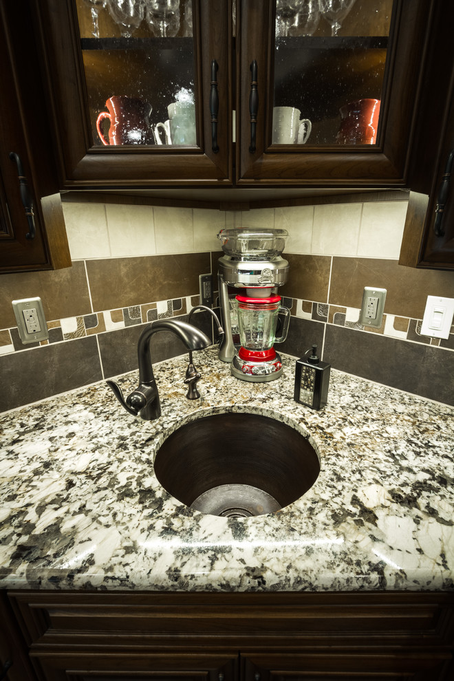 Example of a large transitional l-shaped open concept kitchen design with an undermount sink and two islands