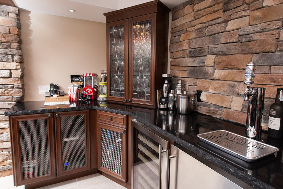 Inspiration for a single-wall ceramic tile wet bar remodel in Toronto with recessed-panel cabinets, dark wood cabinets, granite countertops, multicolored backsplash and stone slab backsplash