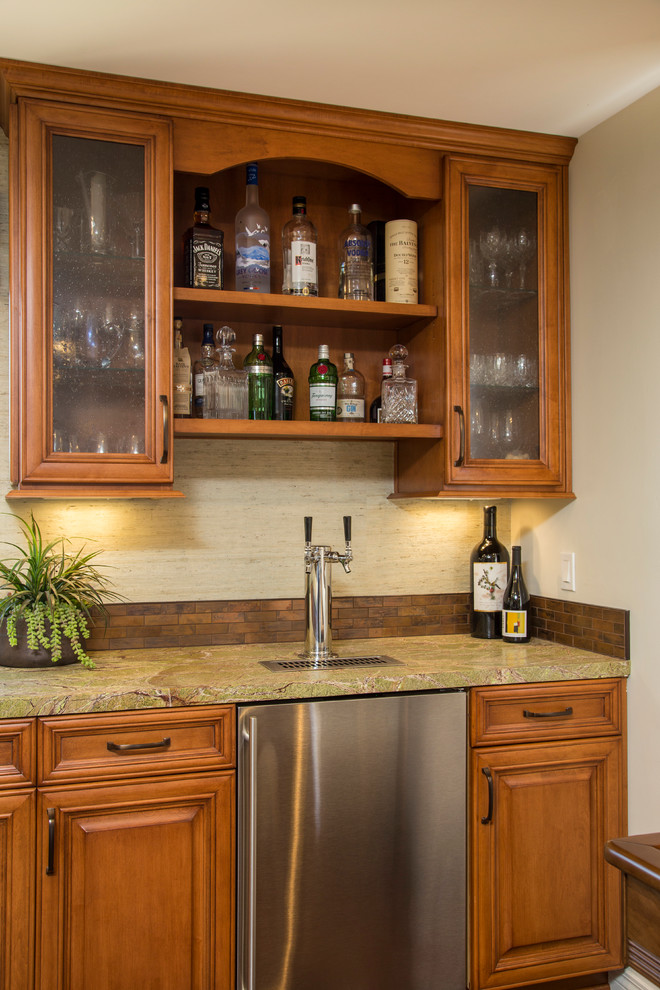 Large country u-shaped seated home bar in San Diego with an undermount sink, recessed-panel cabinets, medium wood cabinets, granite benchtops, metal splashback and dark hardwood floors.