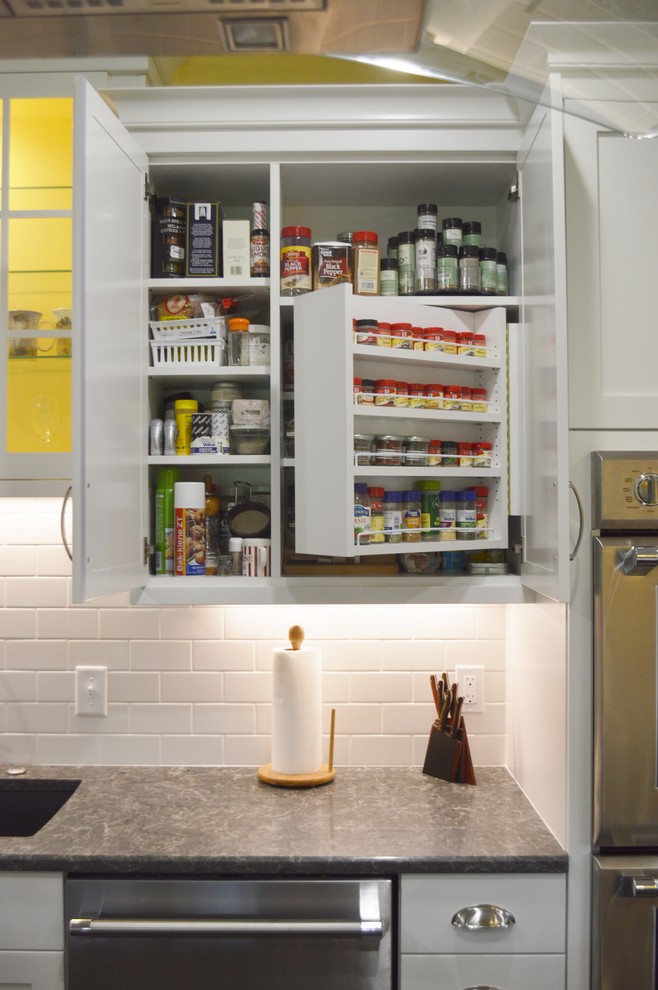 Inspiration for a large dark wood floor kitchen remodel with shaker cabinets, white cabinets, quartzite countertops, white backsplash, subway tile backsplash, stainless steel appliances and an island