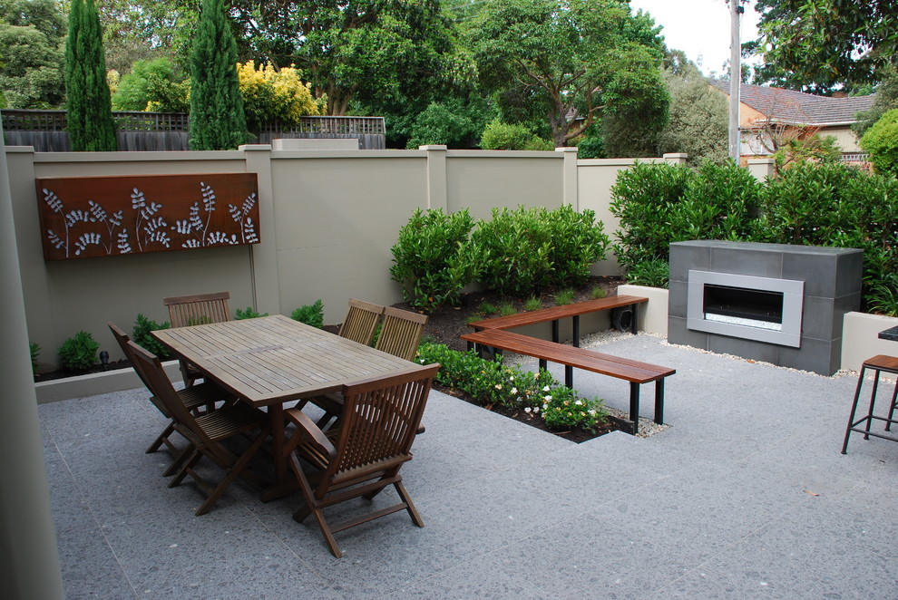 Inspiration for a mid-sized contemporary courtyard patio in Melbourne with an awning.