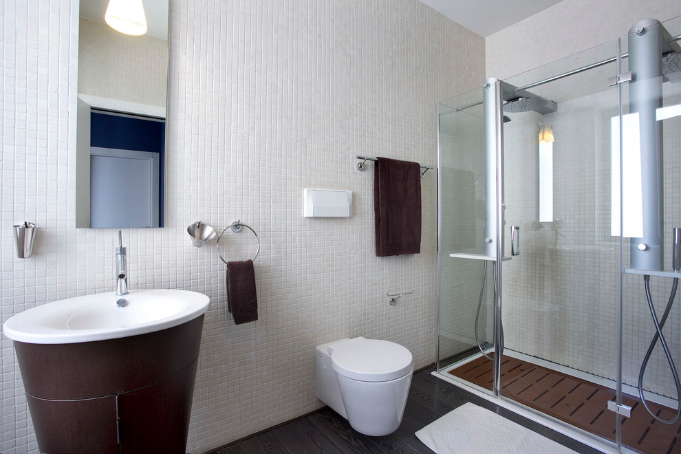This is an example of a contemporary bathroom in Other with a wall-mount toilet.