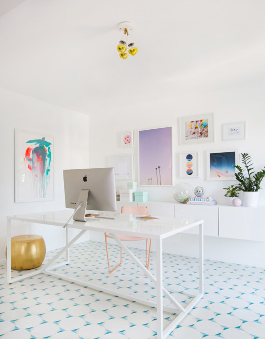 Photo of a small modern home office in San Francisco with white walls, ceramic floors and a freestanding desk.