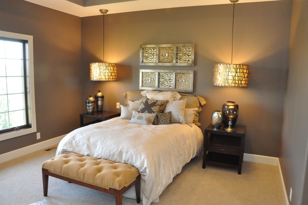 Inspiration for a small arts and crafts master bedroom in Omaha with brown walls and carpet.