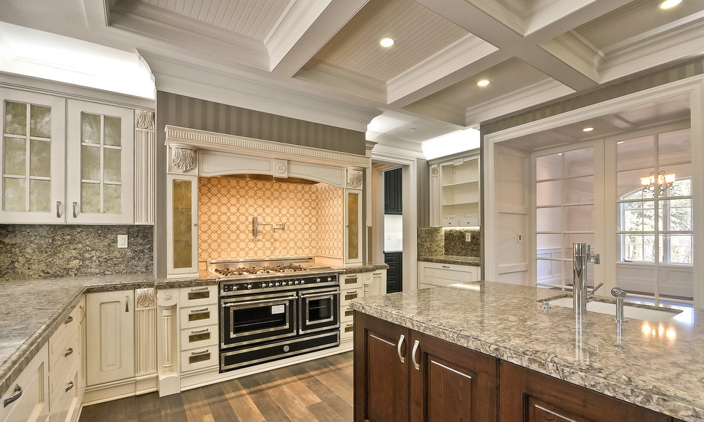 Inspiration for a large traditional u-shaped eat-in kitchen in San Francisco with recessed-panel cabinets, white cabinets, quartz benchtops, stainless steel appliances and with island.