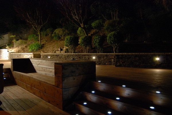 Large elegant backyard concrete paver patio photo in Orange County