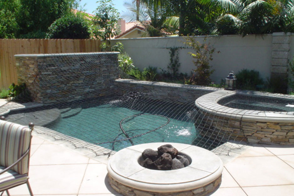 This is an example of a small traditional backyard rectangular lap pool in Orange County with a hot tub and concrete slab.