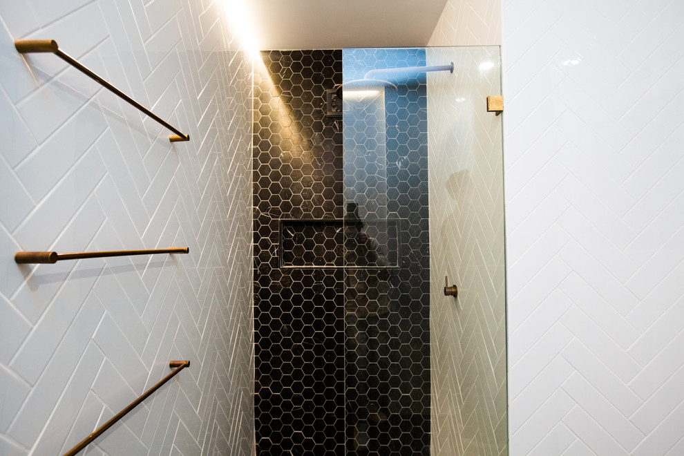 Inspiration for a mid-sized eclectic bathroom in Sydney with white tile, white walls and black floor.