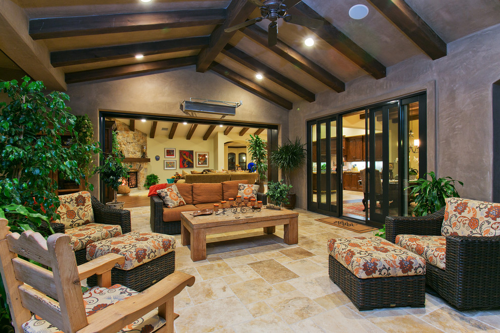 Photo of a traditional patio in San Diego with a roof extension.