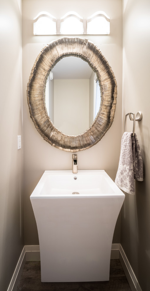Home design - transitional gray tile home design idea with a two-piece toilet and a pedestal sink
