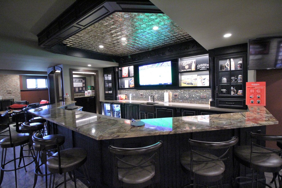 Large country home bar in Chicago with light hardwood floors.