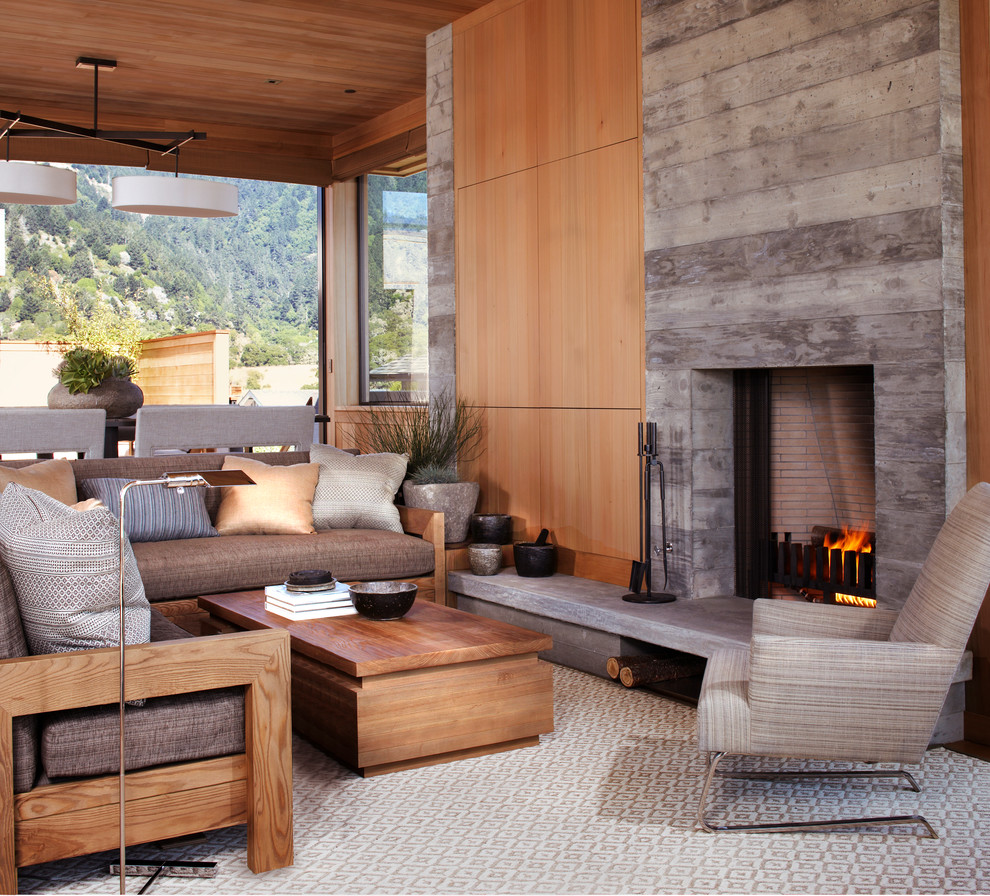 Inspiration for a small beach style open concept living room in San Francisco with a standard fireplace and a concrete fireplace surround.