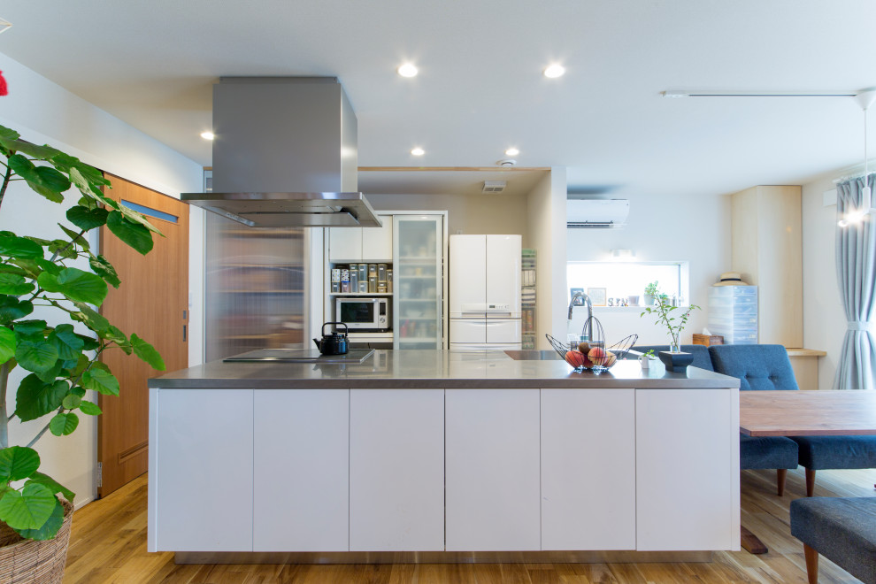 他の地域にあるアジアンスタイルのおしゃれなキッチンの写真