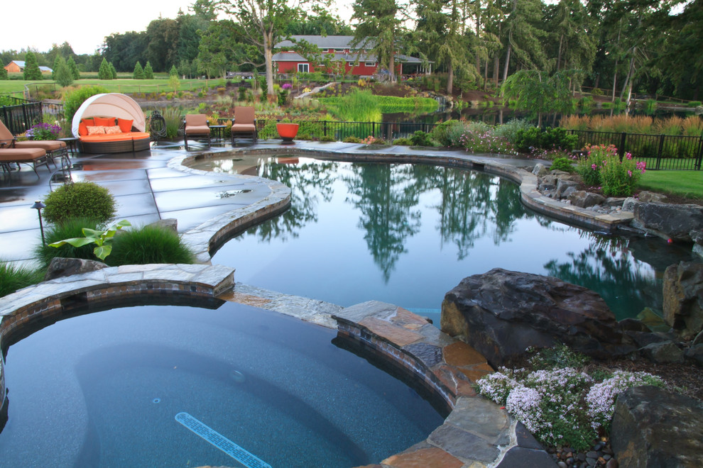 Design ideas for a mid-sized arts and crafts natural pool in Portland.