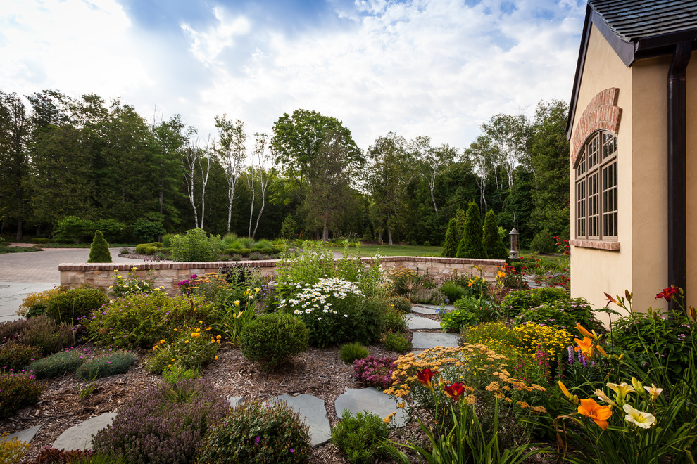 This is an example of a large rustic full sun front yard landscaping.