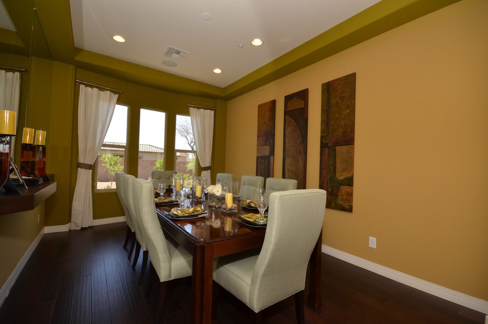 This is an example of a large traditional separate dining room in Phoenix with brown walls and ceramic floors.