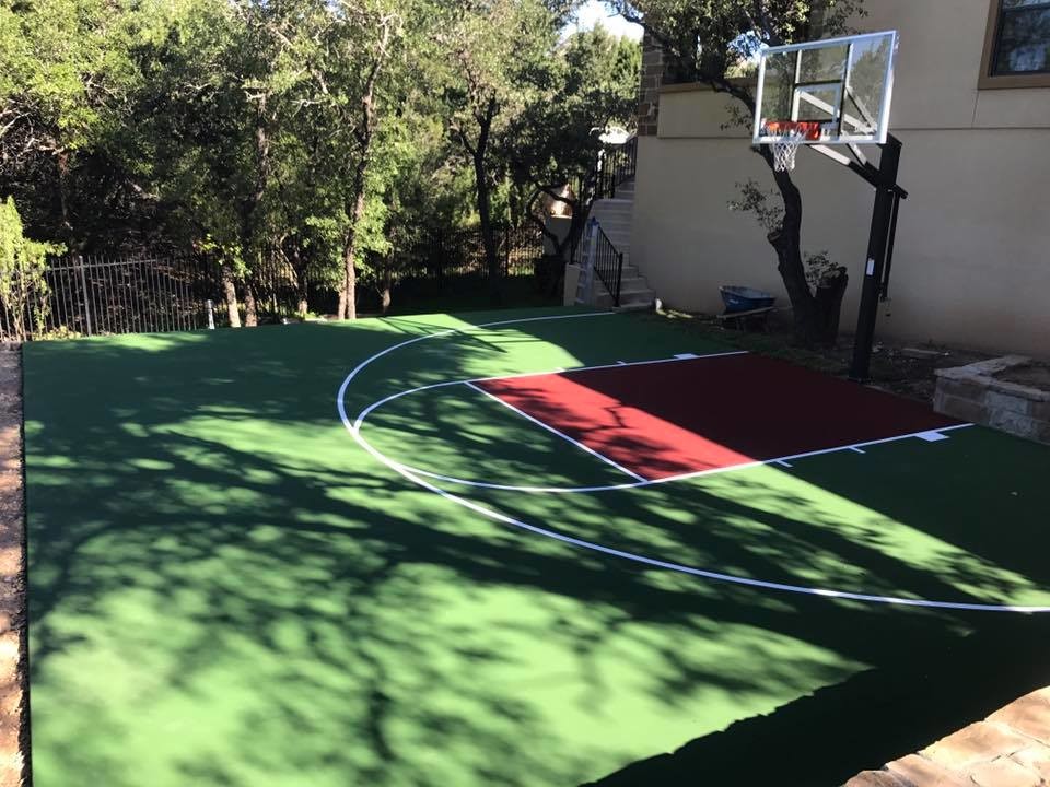Design ideas for a mid-sized traditional backyard partial sun outdoor sport court for summer in Austin with with outdoor playset and concrete pavers.