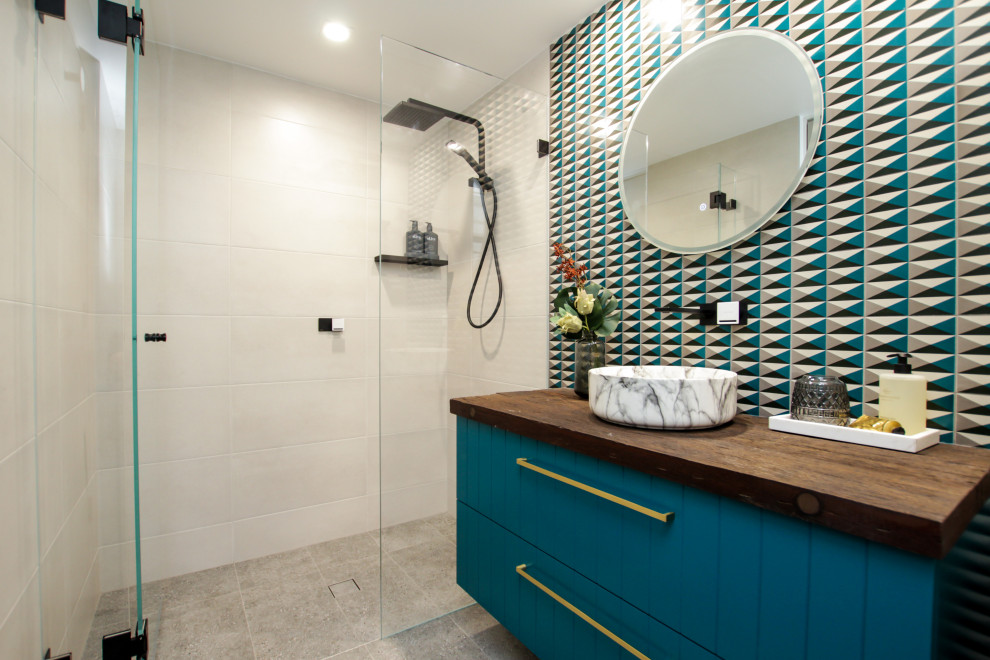 Inspiration for a small eclectic 3/4 bathroom in Sydney with blue cabinets, a two-piece toilet, a vessel sink, wood benchtops, a hinged shower door, a single vanity and a freestanding vanity.