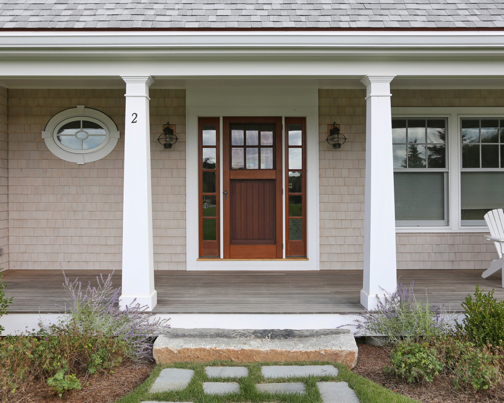 This is an example of a beach style entryway in Boston with a single front door.