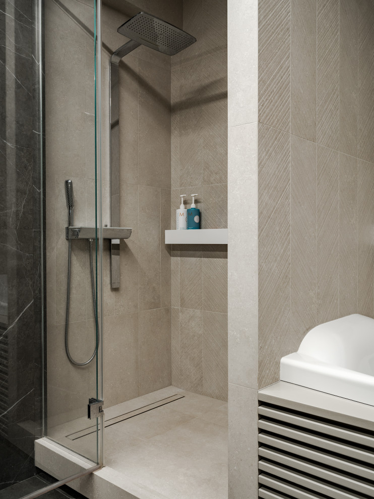 Design ideas for a mid-sized contemporary master bathroom in Saint Petersburg with flat-panel cabinets, beige cabinets, a hot tub, an alcove shower, a wall-mount toilet, beige tile, ceramic tile, beige walls, porcelain floors, an integrated sink, solid surface benchtops, black floor, a hinged shower door, white benchtops, a single vanity and a floating vanity.
