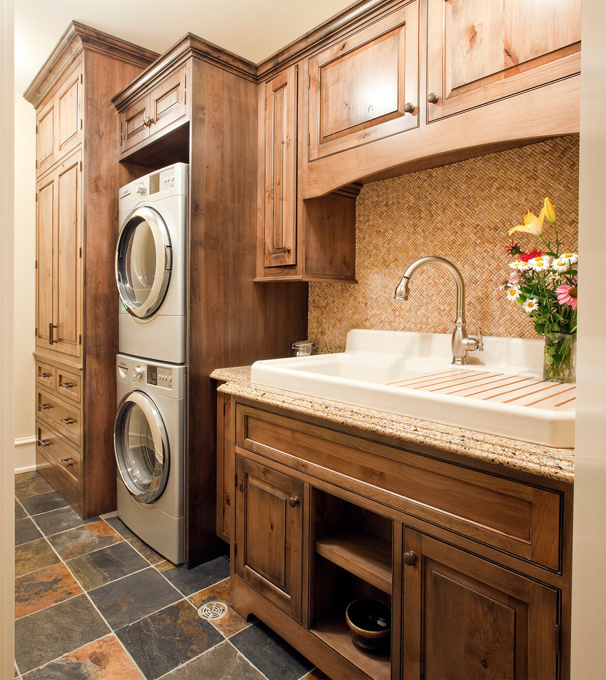 Inspiration for a mid-sized traditional single-wall laundry room in Chicago with a farmhouse sink and beaded inset cabinets.