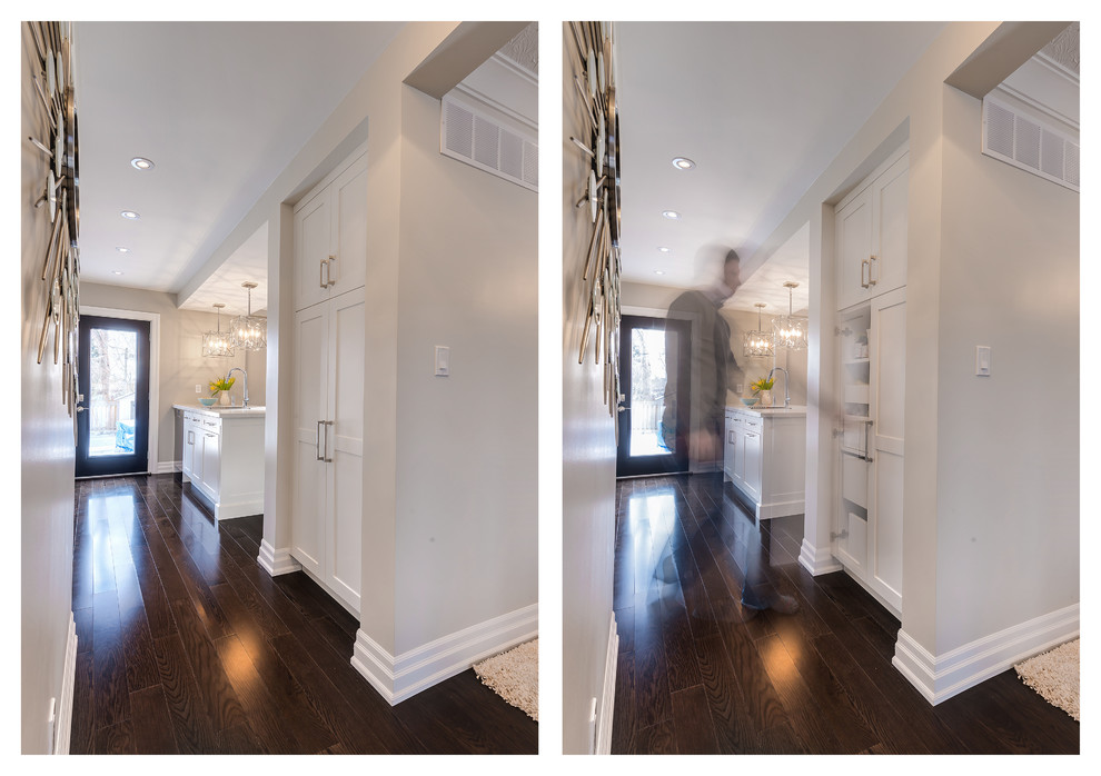 Small transitional galley dark wood floor kitchen pantry photo in Toronto with an undermount sink, shaker cabinets, white cabinets, quartz countertops, white backsplash, stone slab backsplash, stainless steel appliances and an island