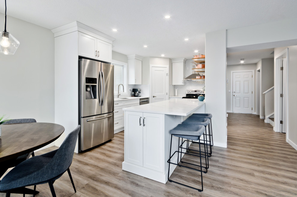 Mid-sized transitional kitchen photo in Calgary with an island