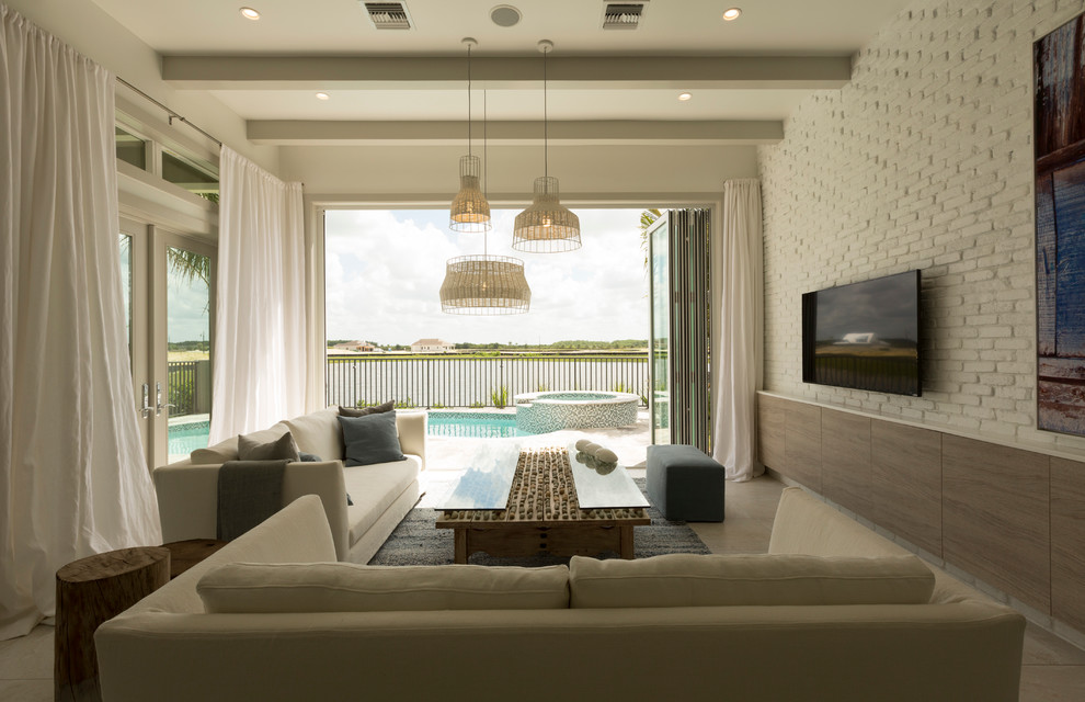 Mid-sized transitional formal open concept living room in Miami with white walls, ceramic floors and a wall-mounted tv.
