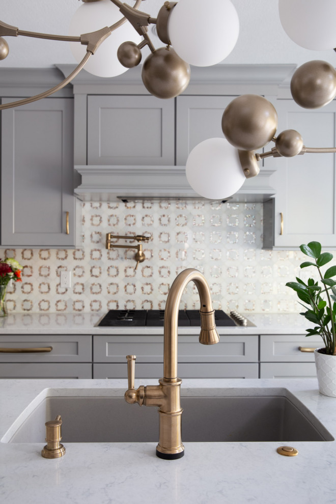 Kitchen - transitional dark wood floor and brown floor kitchen idea with a drop-in sink, shaker cabinets, gray cabinets, quartzite countertops, white backsplash, mosaic tile backsplash, stainless steel appliances, an island and white countertops