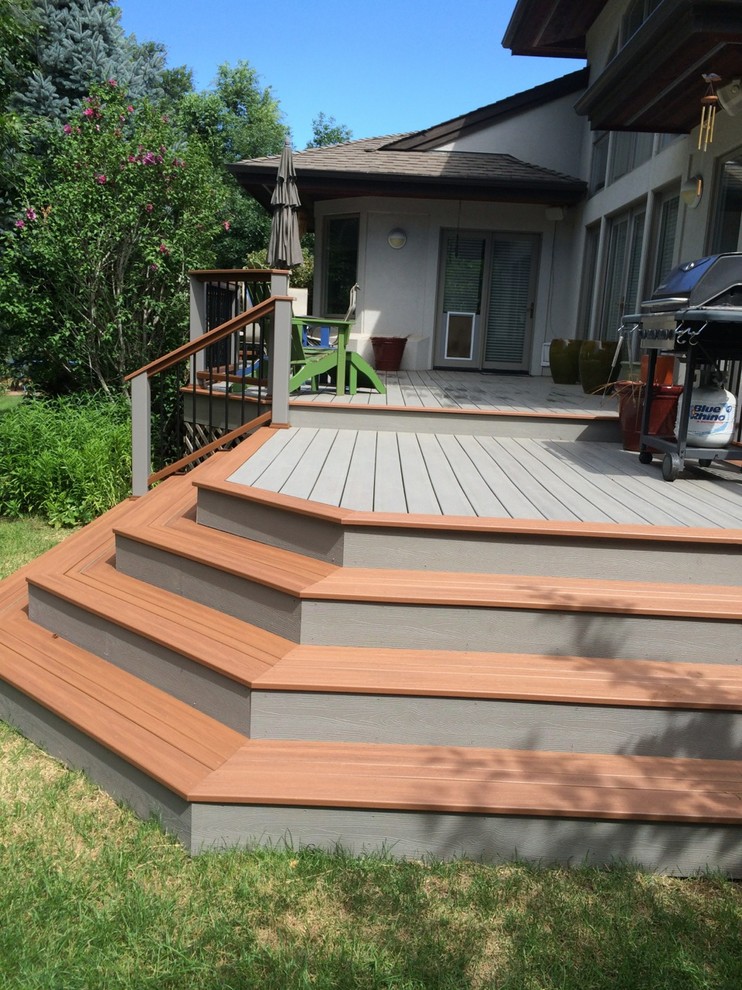 Large mountain style backyard deck photo in Denver with no cover