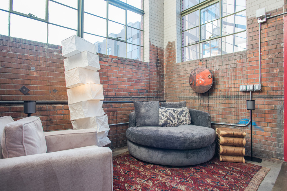 Inspiration for an industrial open concept living room in Denver.