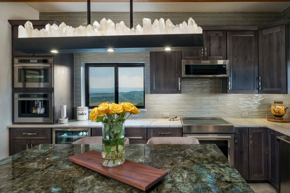 Inspiration for a mid-sized country u-shaped separate kitchen in Denver with a single-bowl sink, shaker cabinets, grey cabinets, quartzite benchtops, grey splashback, glass tile splashback, stainless steel appliances, terrazzo floors, with island, white floor, multi-coloured benchtop and exposed beam.