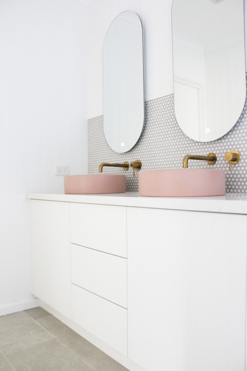 Patterned Play: White Vanity with Pink Vessel Sinks and Penny Tile Backsplash