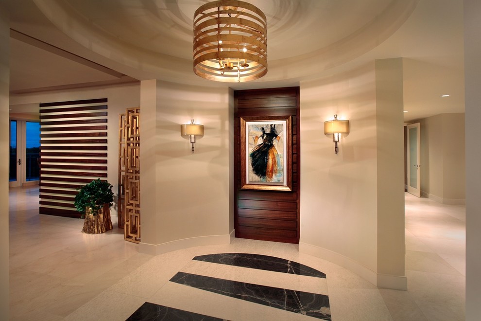 Contemporary foyer in Miami with beige walls and multi-coloured floor.