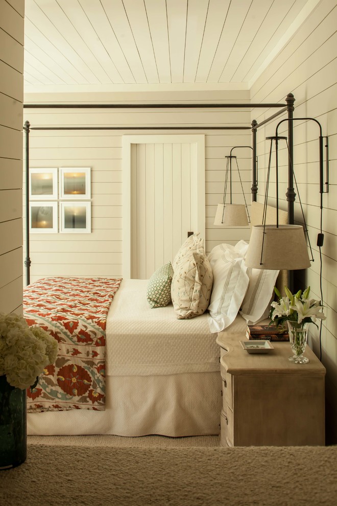 Example of a mountain style carpeted bedroom design in New York with beige walls