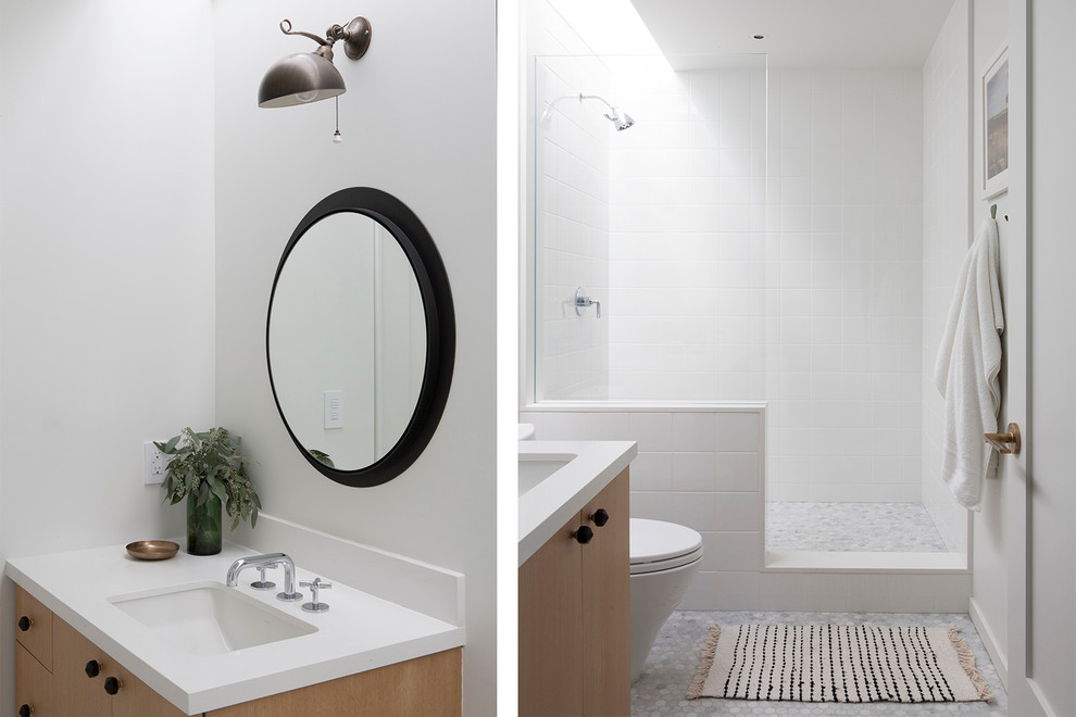 Doorless shower - mid-sized modern kids' white tile and ceramic tile marble floor doorless shower idea in Los Angeles with furniture-like cabinets, light wood cabinets, a one-piece toilet, white walls, an undermount sink and quartz countertops