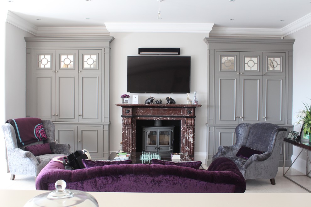 This is an example of a transitional family room in London.