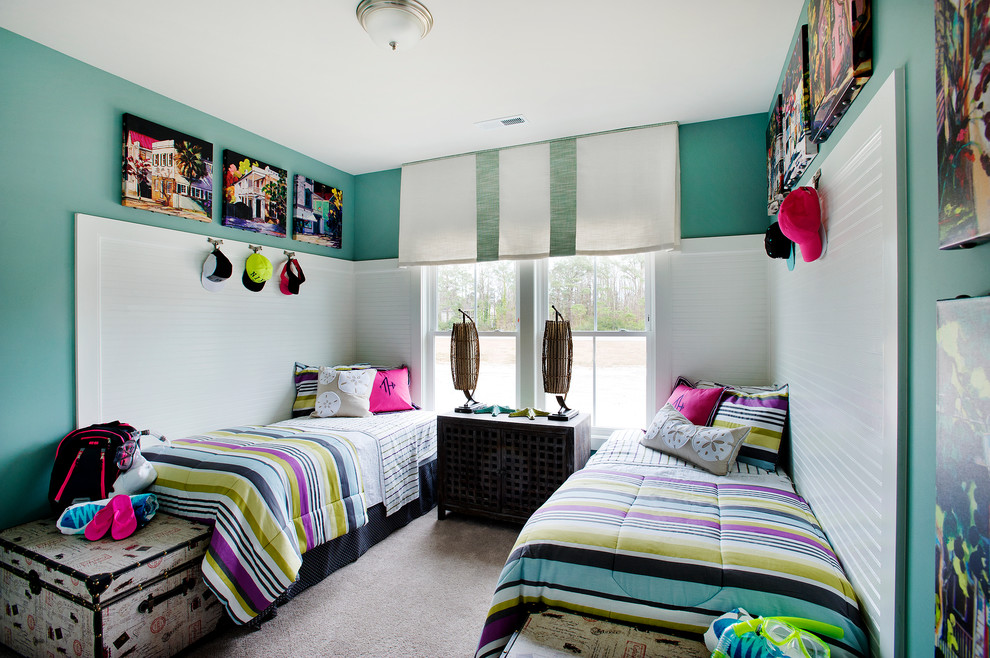 This is an example of a contemporary kids' room for girls in Chicago with blue walls and carpet.