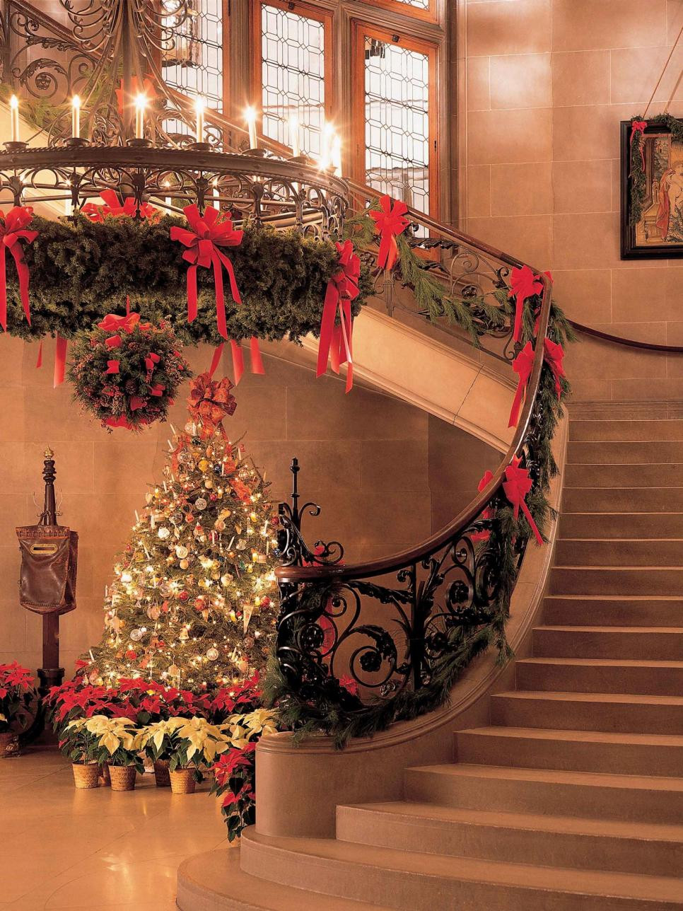 CHRISTMAS CENTER STAIRCASE WITH DECORATED BANISTER BY PETER ATKINS