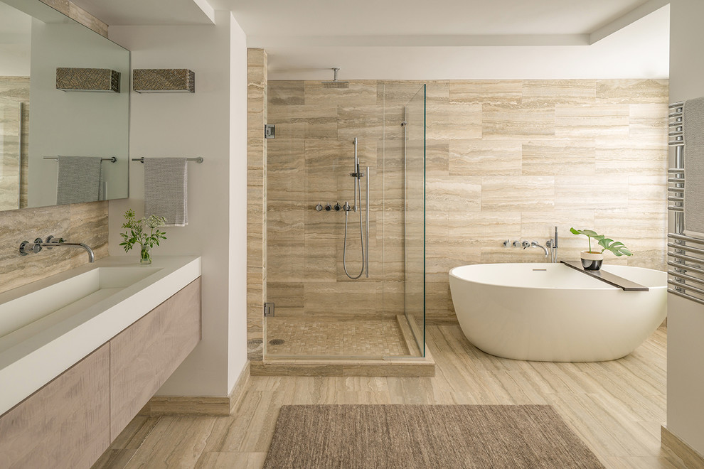Design ideas for a large modern master bathroom in Boston with flat-panel cabinets, light wood cabinets, a freestanding tub, a corner shower, brown walls, a wall-mount sink, engineered quartz benchtops, a hinged shower door, white benchtops and a floating vanity.