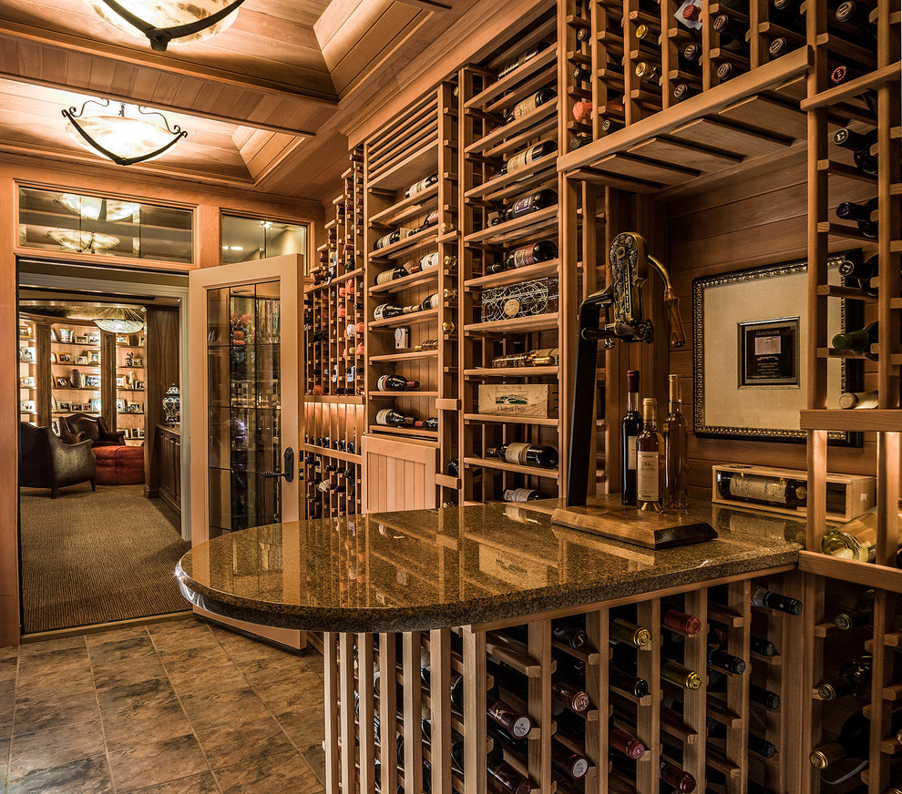 Photo of a mid-sized traditional wine cellar in Chicago with slate floors and display racks.