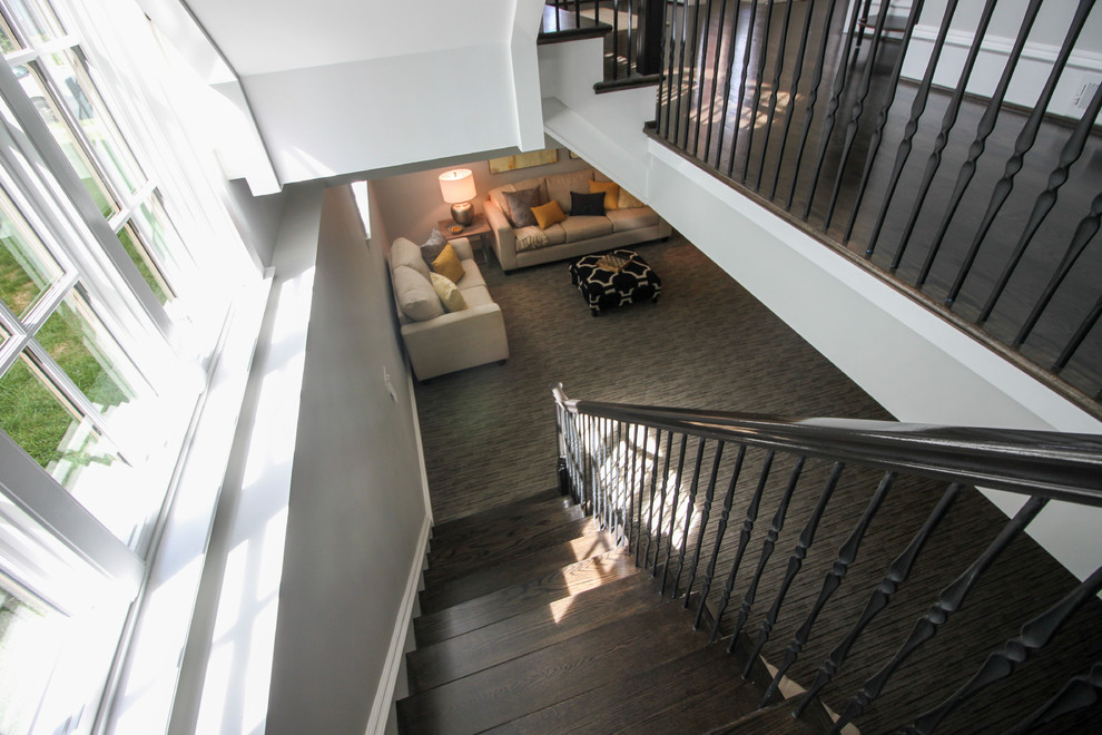 Inspiration for a large transitional wooden l-shaped mixed material railing staircase remodel in DC Metro with painted risers