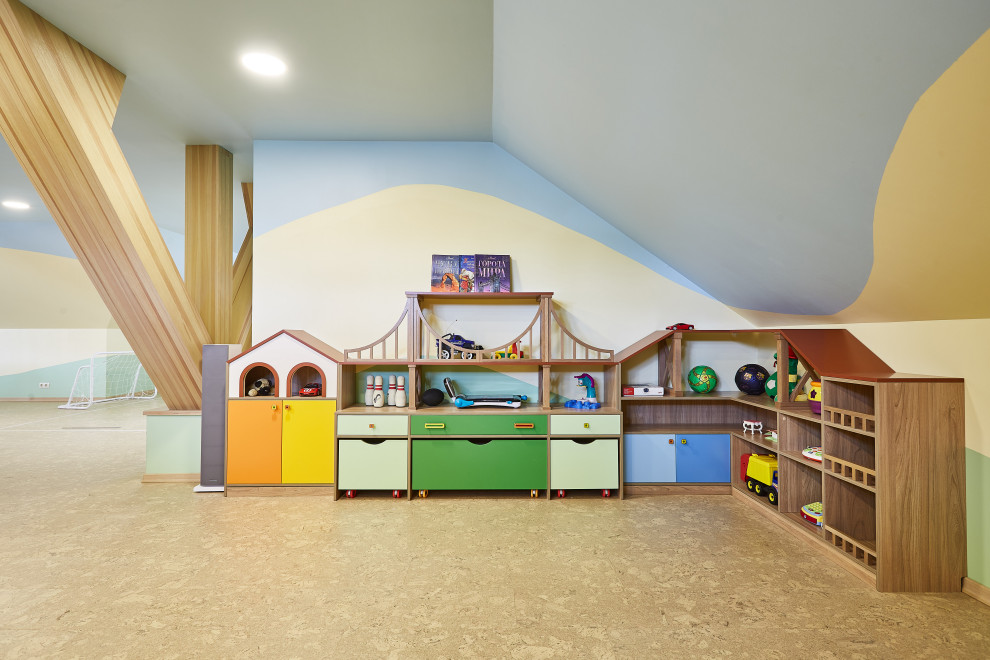 Inspiration for a small contemporary kids' playroom for kids 4-10 years old and boys in Yekaterinburg with multi-coloured walls and cork floors.