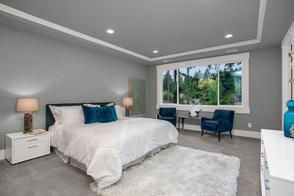 Design ideas for a transitional master bedroom in Seattle with grey walls and carpet.