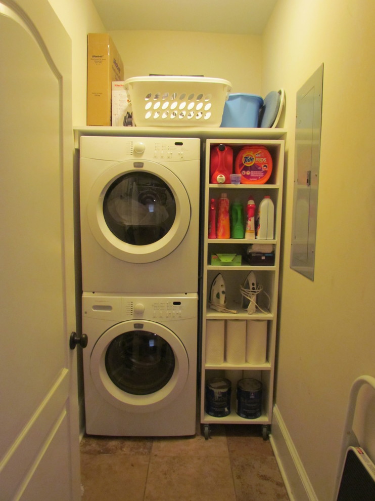 Contemporary laundry room in Atlanta with a stacked washer and dryer.