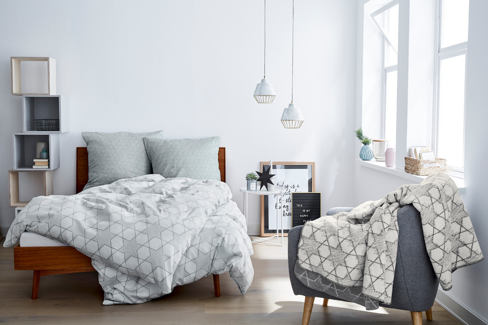 Design ideas for a small scandinavian master and grey and pink bedroom with white walls, painted wood flooring, grey floors and no fireplace.