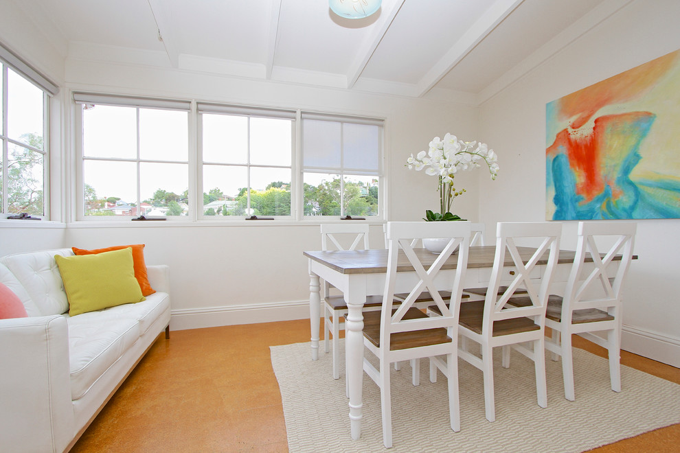 Design ideas for a small contemporary separate dining room in Hobart with white walls and cork floors.