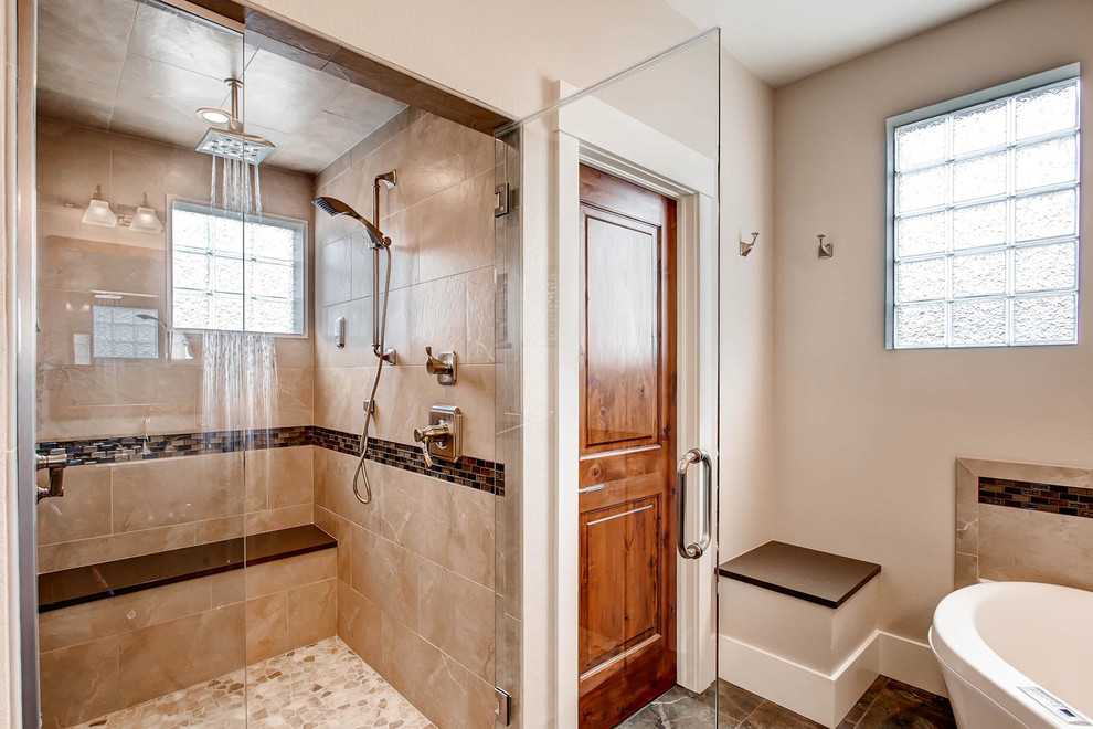 Inspiration for a mid-sized transitional gray tile and porcelain tile porcelain tile corner bathtub remodel in Denver with shaker cabinets, medium tone wood cabinets, a one-piece toilet, gray walls, an undermount sink and solid surface countertops