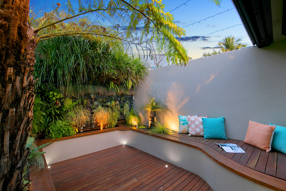 Inspiration for a midcentury backyard garden in Sydney with decking.